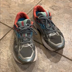 Brooks pink, blue, and gray running tennis shoes